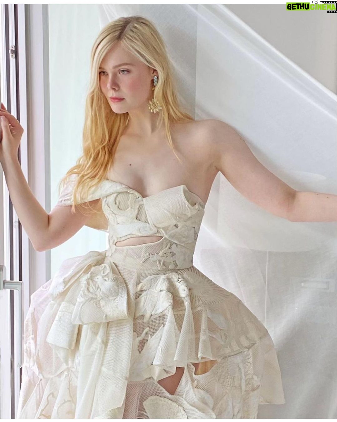 Elle Fanning - 726.5K Likes - @alexandermcqueen dress of DREAMS ☁️🤍☁️ and a custom @ireneneuwirth earring 🌻💎🌻 for @criticschoice ! a girl could never ask for more! Thank you for adding to such a special night of celebrating our show @girlfromplainvillehulu