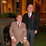 Elton John Instagram – Ahead of #WorldAIDSDay, I am honoured to receive recognition for my lifetime work with @ejaf from @appg.hiv.aids during a special reception at Speakers House. It was great to meet with political leaders, with @davidfurnish and @anneaslett, to discuss how England could be the first country to end new cases of HIV.

We can’t end AIDS without the backing of the @ukgovofficial and today, we’re delighted by @victoriaatkinsmp’s announcement to expand opt-out HIV testing to every high prevalence area across the country.

My Foundation and partners led the world’s first HIV Social Impact Bond in London which proved that opt-out HIV testing in A&Es works to find and diagnose HIV in people who didn’t know they were living with the virus. Not only does it save money, more importantly, it saves lives. The earlier people know they are living with HIV, they can start treatment and prevent the spread to others.

We must keep our foot on the accelerator to end AIDS.

📸: @davebenett Speakers House, The House of Commons