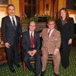 Elton John Instagram - Ahead of #WorldAIDSDay, I am honoured to receive recognition for my lifetime work with @ejaf from @appg.hiv.aids during a special reception at Speakers House. It was great to meet with political leaders, with @davidfurnish and @anneaslett, to discuss how England could be the first country to end new cases of HIV. We can’t end AIDS without the backing of the @ukgovofficial and today, we’re delighted by @victoriaatkinsmp’s announcement to expand opt-out HIV testing to every high prevalence area across the country. My Foundation and partners led the world’s first HIV Social Impact Bond in London which proved that opt-out HIV testing in A&Es works to find and diagnose HIV in people who didn’t know they were living with the virus. Not only does it save money, more importantly, it saves lives. The earlier people know they are living with HIV, they can start treatment and prevent the spread to others. We must keep our foot on the accelerator to end AIDS. 📸: @davebenett Speakers House, The House of Commons