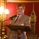 Elton John Instagram – Ahead of #WorldAIDSDay, I am honoured to receive recognition for my lifetime work with @ejaf from @appg.hiv.aids during a special reception at Speakers House. It was great to meet with political leaders, with @davidfurnish and @anneaslett, to discuss how England could be the first country to end new cases of HIV.
We canβt end AIDS without the backing of the @ukgovofficial and today, weβre delighted by @victoriaatkinsmpβs announcement to expand opt-out HIV testing to every high prevalence area across the country.
My Foundation and partners led the worldβs first HIV Social Impact Bond in London which proved that opt-out HIV testing in A&Es works to find and diagnose HIV in people who didnβt know they were living with the virus. Not only does it save money, more importantly, it saves lives. The earlier people know they are living with HIV, they can start treatment and prevent the spread to others.
We must keep our foot on the accelerator to end AIDS.
πΈ: @davebenett Speakers House, The House of Commons