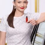 Enzy Storia Instagram - Effortless elegance in one swipe with shade 420 Le Rouge Paris. Discover the power of bold with @lorealparis #OneBoldSwipe