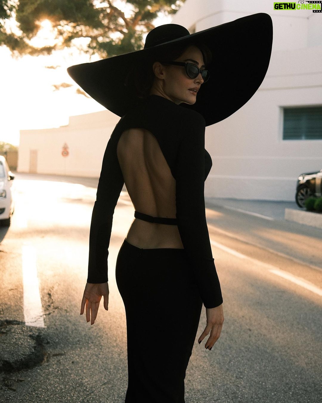 Esra Bilgiç Instagram - we see a girl with a big black hat and always in black. #Cannes23 Cannes, French Riviera, France