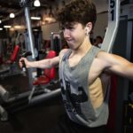 Ethan Wacker Instagram - A lot of people have been asking me for my workout routine. This is my chest workout. KEEP IN MIND I AM NOT A TRAINED PROFESSIONAL!! I am just someone who works out a lot and this is what works for me: •Start with 5-10 mins of stretching •Flat Bench Press: 5 sets 8-10 reps per set. 2 sets of pause reps at the end with reduced weight, 8-10 reps per set. •Incline Dumbbell Bench Press: 5 sets, 10-12 reps per set •Chest Flys: 5 sets, 10-12 reps per set •Chest Press Machine: 3 sets, 10-15 reps per set •Dips: 3 sets, to failure each set •Cable Flys: 3 sets, 8-10 reps per set. Lmk in the comments if you want to see the workouts I do for back and biceps, shoulders, and abs. I’ll get back to doing legs soon, still got about a month or so until I can start using my leg in workouts. UFC GYM