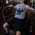 Ethan Wacker Instagram - A lot of people have been asking me for my workout routine. This is my chest workout. KEEP IN MIND I AM NOT A TRAINED PROFESSIONAL!! I am just someone who works out a lot and this is what works for me: •Start with 5-10 mins of stretching •Flat Bench Press: 5 sets 8-10 reps per set. 2 sets of pause reps at the end with reduced weight, 8-10 reps per set. •Incline Dumbbell Bench Press: 5 sets, 10-12 reps per set •Chest Flys: 5 sets, 10-12 reps per set •Chest Press Machine: 3 sets, 10-15 reps per set •Dips: 3 sets, to failure each set •Cable Flys: 3 sets, 8-10 reps per set. Lmk in the comments if you want to see the workouts I do for back and biceps, shoulders, and abs. I’ll get back to doing legs soon, still got about a month or so until I can start using my leg in workouts. UFC GYM