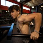 Ethan Wacker Instagram - A lot of people have been asking me for my workout routine. This is my chest workout. KEEP IN MIND I AM NOT A TRAINED PROFESSIONAL!! I am just someone who works out a lot and this is what works for me: •Start with 5-10 mins of stretching •Flat Bench Press: 5 sets 8-10 reps per set. 2 sets of pause reps at the end with reduced weight, 8-10 reps per set. •Incline Dumbbell Bench Press: 5 sets, 10-12 reps per set •Chest Flys: 5 sets, 10-12 reps per set •Chest Press Machine: 3 sets, 10-15 reps per set •Dips: 3 sets, to failure each set •Cable Flys: 3 sets, 8-10 reps per set. Lmk in the comments if you want to see the workouts I do for back and biceps, shoulders, and abs. I’ll get back to doing legs soon, still got about a month or so until I can start using my leg in workouts. UFC GYM