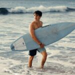 Ethan Wacker Instagram – When in Hawaii, you kinda have to surf 🏄🏼‍♂️. Don’t let these pics fool you tho, I’m so bad at it 😭😂 Honolulu, Hawaii