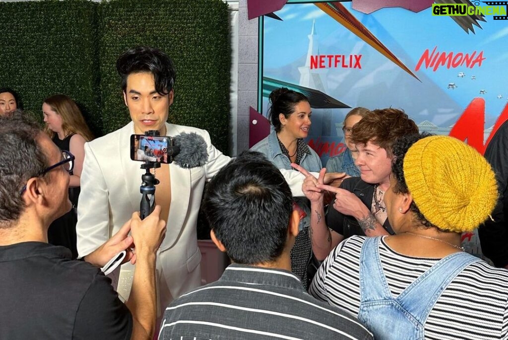 Eugene Lee Yang Instagram - NIMONA premiere! I can’t wait for y’all to experience this hilarious, heartbreaking, headstrong film that fought to be seen. Watch it on Netflix this Friday June 30! 🤘 styling by @colinmanderson makeup & hair by @monicaalvarezmakeup suit by @helenanthonyofficial necklace by @misterpurl vintage clutch by @ysl shoes by @shaunross x @unitednude New York City