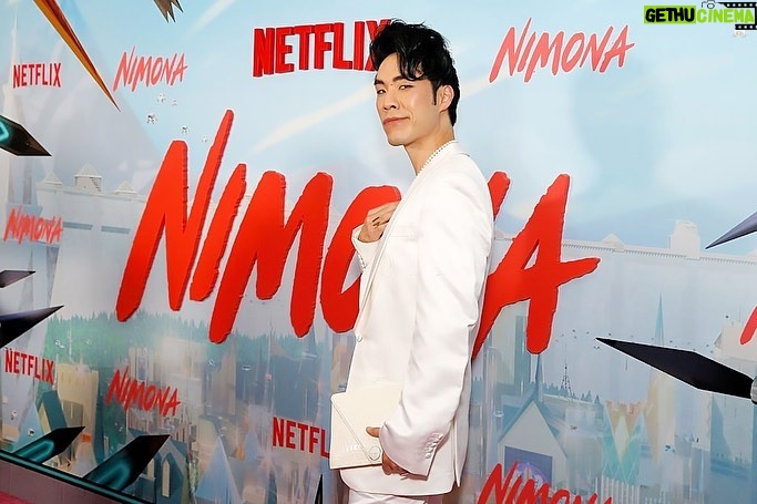 Eugene Lee Yang Instagram - NIMONA premiere! I can’t wait for y’all to experience this hilarious, heartbreaking, headstrong film that fought to be seen. Watch it on Netflix this Friday June 30! 🤘 styling by @colinmanderson makeup & hair by @monicaalvarezmakeup suit by @helenanthonyofficial necklace by @misterpurl vintage clutch by @ysl shoes by @shaunross x @unitednude New York City
