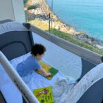 Eve Instagram - Just a little #reading by the #sea back with my #beautifulboy 💙🌊📖 Ras al Khaima