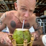 Flea Instagram - strange little old man sucks on coconut pic by @samuelbanuelosthe3rd