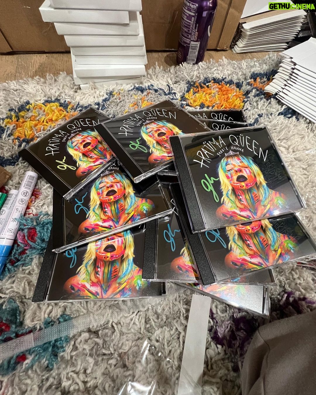 Gabbie Hanna Instagram - Fred & I are signing and packing the last of the Trauma Queen CDs- if you order tonight I’ll be able to get it out with this batch 💋 👑 my next album comes out tomorrow night wow
