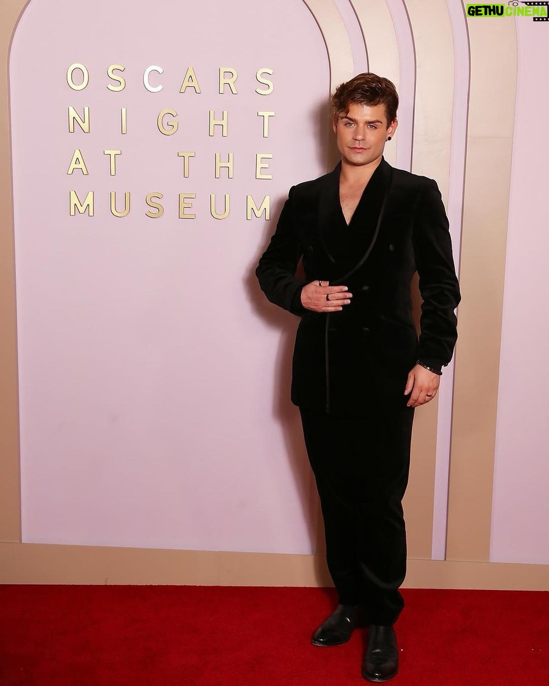 Garrett Clayton Instagram - What a beautiful night @academymuseum watching the #oscars @theacademy Thank you @meta & @threads for bringing us. Also a big thank you to @allzedetails , @lulyyangcouture, and @brooksbrothers for these 10/10 suits