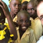 Gerard Butler Instagram - What an eventful couple of weeks. Been cheered up to no end by these beautiful souls who despite living in a country that has gone through so much hardship, have nothing but love to give. A real lesson for me right now. So pleased to be in Haiti with @MarysMeals visiting schools to see the wonderful work they do. Communities are transformed by what @MarysMeals does to feed children in a place of education. It’s such a simple idea that works really well. I’ve seen it in action in Liberia, and now Haiti.  Link in bio for their website MarysMeals.org, or follow @MarysMeals for more pictures and videos from this trip! #Haiti #MarysMeals #school #meals #hope #joy #food #education