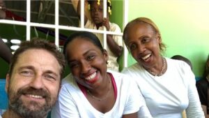 Gerard Butler Instagram - What an eventful couple of weeks. Been cheered up to no end by these beautiful souls who despite living in a country that has gone through so much hardship, have nothing but love to give. A real lesson for me right now. So pleased to be in Haiti with @MarysMeals visiting schools to see the wonderful work they do. Communities are transformed by what @MarysMeals does to feed children in a place of education. It’s such a simple idea that works really well. I’ve seen it in action in Liberia, and now Haiti.  Link in bio for their website MarysMeals.org, or follow @MarysMeals for more pictures and videos from this trip! #Haiti #MarysMeals #school #meals #hope #joy #food #education
