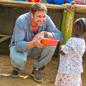 Gerard Butler Instagram - Hi everyone! As you may have noticed, I’ve taken a bit of a “summer break” from social media. I don’t need to tell you that these are some crazy times we’re living in, and it’s more important than ever to look out for each other. As it’s #InternationalDayOfCharity today, what better moment to highlight a cause that I love and have worked with for many years - @marysmeals, an org founded by a fellow Scotsman! It is never a dull moment getting to spend time with the amazing kids Mary’s Meals serves, and I feel honored to be a part of such an important cause. So many children around the world rely on their school for daily meals, and even during COVID-19, Mary’s Meals has made it their mission to link food to education and help these students get fed. It’s so much more than just meals! In this uncertain time, I encourage you to do some digging, and if not Mary’s Meals, use this day to find a cause that matters to you. Join me in finding a way to give back, whether it’s with your time, your words, or a small donation. I think it will bring you some peace. Sending love your way 🙏