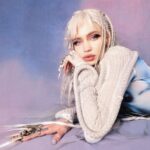 Grimes Instagram – Launching new A.I. Girl group NOV 12! 

(Were super behind on everything and you’ll all see why in a month or so , so I apologize abt delays of music and visuals.  Gna be catching up on the girls visual development and whatnot – but me and @chrislake just needed to get this song out cuz it’s been going so hard at festivals!!!! 

(((((PS i included the un retouched image cuz this is more retouching than i normally do and whilst I look hot haha I do fear for the mental health effects of ye olde photo shoppé 

I may have had some filler mishaps over the years but def didn’t get a nose job haha