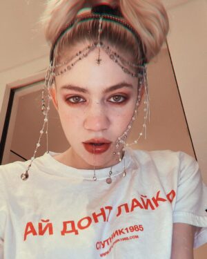Grimes Instagram - ppl make fun of my big nose and weird face but I think it’s cool to be strange.  Took me a while to figure out how to make makeup look good cuz regular tricks don’t work.  But I’m grateful to be oddly designed