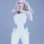 Grimes Instagram – un-used press photo where I tried to make a cyborg body in manga studio haha.  Omg I finally get to drop my damn album in less than a month! Feeling good today but My clothes don’t fit 👿 dogs are incredible 🤍🐁🌙