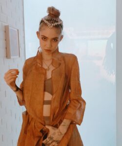 Grimes Instagram - People never touched each other. The custom had become obsolete, owing to the machine