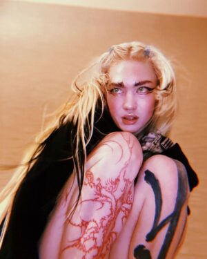 Grimes Instagram - Obligatory "plz listen to new music " post (link in bio)

Altho I do genuinely love and adore this song ngl, @anyma - if I ever get to do a video for it rly feeling some sci fi phantom of the opera thing where I'm the phantom and we're the only two ppl left on a giant spacecraft that's lost contact.  Like toxic horror pseudo Victorian gay space romance. 

Ps so stoked w this tattoo by @caidasindesamparo - got a bunch of amazing pics of it yesterday 🙏🏻 I am marveling at this masterpiece on my leg 🚀🪐🤍