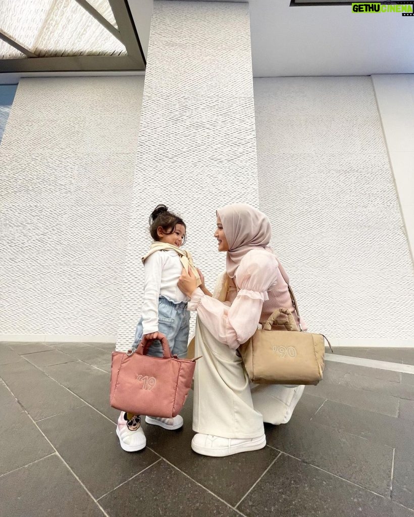 Hanis Zalikha Instagram - When we have matching get-ups, we OOTD! Still can’t believe my girl has left her baby phase behind so I must capture more moments like this 🥹 Anyhoo, this Puffy Mini Tote is the bag of the moment! You will see me a lot with it, I promise — it’s so spacious and so so cool. Sometime Bag @sometime_byasiandesigners just launched them yesterday so grab yours now!