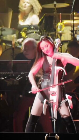Hans Zimmer Instagram - I know you all love our @HansZimmerLive shows, but have you ever met the band members?! We are a wacky and crazy bunch and it was about time to introduce everyone!
For the first #HansZimmerLive Meet the Band... it's the iconic Ms. @TinaGuo! Born in China to classical musicians, Tina fell in love with heavy metal and bought an electric cello to weaponize the sounds of an electric guitar. She struggled for years and did odd jobs like doing infomercials, playing the cello at funerals and even considered training to become a dominatrix. As a last-ditch effort to become a genre-fluid cellist, she recorded a metal version of "Flight of the Bumblebee" that went viral, and that music video inspired me to hire her for the #SherlockHolmes movie and eventually #WonderWoman. She puts on one hell of a live show, too!