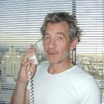 Ian McKellen Instagram – #TBT 10 April 2000, on a direct line to Yahoo! HQ (remember when phones had cords?). They were taking questions online, which I answered on the phone, to be typed in by somebody else at Yahoo! My first Internet “chat” though by that time my website was already 3 years old!