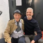 Ian McKellen Instagram - Frederic Aranda @fredericaranda is a London-based portrait photographer whose image of me went viral in 2019. His work has been featured in books and exhibitions, most recently at the National Portrait Gallery for the Taylor Wessing Portrait Prize. He's worked with the Royal Ballet, the Kabuki and puppet theatres in Japan, the RSC and the Passion Play in Oberammergau (on my recommendation). Recently he brought his camera backstage at "Mother Goose." We'll be posting some of the results in coming days. I'll let him take it from here, with a fascinating look behind the scenes of a photographer's process: "I'm passionate about photographing people and have been doing it for 20 years. When I'm not shooting, I often dream about it at night — about how I would stage a group portrait for example, and what I'd capture of each person in it. I compose images in my head all the time. "I'm very interested in what happens behind the scenes, peeking through the curtain or through a half open dressing room door. I love capturing the warm ups, the rising tension and the transformations backstage. I'm curious about how it all works. I admire all the wonderful people you never see on the stage who make it all fit together and work so smoothly. My approach has been to capture without directing, staging or meddling. I wanted them to pretend I wasn't there. "Photographing Mother Goose backstage has been the most wonderful privilege. Not just because of the world class talent, but also because it's exactly the joyful balm that we all need right now. I laugh when I hear the jokes, no matter how many times I've heard them before. The songs are excellent too. "During Mother Goose I loved photographing Ian's transformation in his dressing room and also his quick changes in the wings. It takes 3 or 4 people to get him in and out of costume each time, but in record time. Note that he's tap dancing on stage and doing all sorts of physical feats, and then has to come and get changed each time. There are some amazing moments from the wings behind some of the gauze-screens which really summarise the half on and off-stage feel that I wanted to capture."