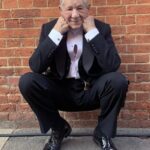 Ian McKellen Instagram - Wimbledon has the Centre Court and also the Theatre, where I first appeared in the pre-West End run of "A Scent of Flowers." I shared a dressing room with the late Peter Howell. There we were by the stage door, enjoying the late summer sun after a Wednesday matinée in 1964. https://mckellen.com/stage/00028b.htm Yesterday I was back on location at Wimbledon Theatre, by the same distinctive brick wall, after my first day filming Patrick Marber’s screenplay "The Critic."