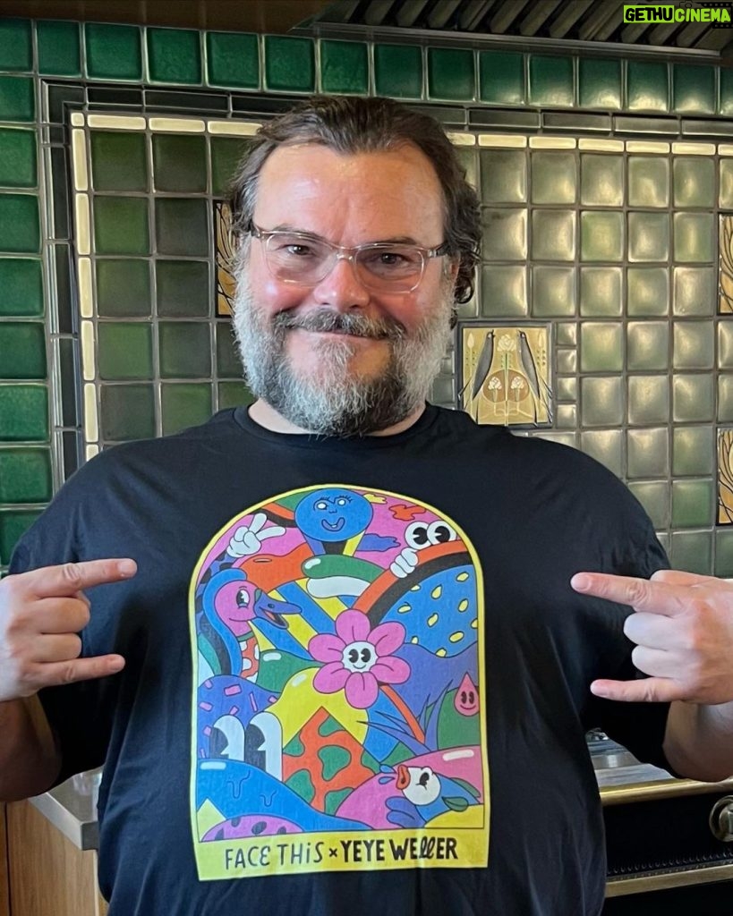 Jack Black Instagram - Let me ask you a question and please read on as I have a special giveaway for you! As we’ve all seen in School Of Rock, kids are incredibly creative. So shouldn’t kids in marginalized areas in Indonesia be able to use their creativity as a force for good? That’s exactly what my friends at @facethistshirts were asking themselves too. Their answer: T-shirts designed by Indonesian school kids, in collaboration with (street)artists from around the world. Like the one I’m wearing right now. It’s designed by artist @yeyeweller and the kids from the Indonesian Duduk Atas school. All proceeds will be used to support the school. So, follow @facethistshirts and get the tee I am wearing now. Because one buyer will get an extra T-shirt, signed by me! . . #socialstreetwear #charity #ootd #artforgood #illustration