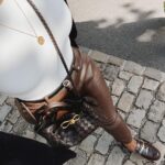 Jackie Aina Instagram - life is great 🥂 headband: amazon tank top: amazon coat: zara pants: Simkhai loafers: Chanel handbag: Bottega Veneta belt: Fendi Beau-Rivage Geneva
