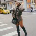 Jackie Aina Instagram - I’m not like other girls, I’m way worse 😘 coat + shorts @jacquemus via @farfetch boots @ralphlauren bag #bottegaveneta photos @nishajohny hair @kendrasboutique