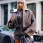 Jackie Aina Instagram - I’m not like other girls, I’m way worse 😘 coat + shorts @jacquemus via @farfetch boots @ralphlauren bag #bottegaveneta photos @nishajohny hair @kendrasboutique