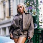 Jackie Aina Instagram - I’m not like other girls, I’m way worse 😘 coat + shorts @jacquemus via @farfetch boots @ralphlauren bag #bottegaveneta photos @nishajohny hair @kendrasboutique