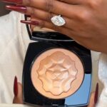 Jackie Aina Instagram - need all my powder highlighters to come with embossed Leo stamps on them going forward 😍 #lessymbolesdechanel