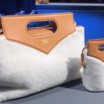 Jackie Aina Instagram - Essential accessories at @mcmworldwide Can confirm the new Crush fragrance smells GORG! #milanfashionweek #mcmworldwide #mcm #mcmfragrance