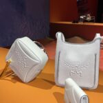 Jackie Aina Instagram - Essential accessories at @mcmworldwide Can confirm the new Crush fragrance smells GORG! #milanfashionweek #mcmworldwide #mcm #mcmfragrance