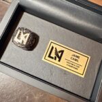 Jaime Camil Instagram - The love I have for @lafc @lafc3252 is unmeasurable 🖤💛 Thank you @lafclarry @lafcrich and all #LAFC owners/managers 🙏🏽🙇🏽‍♂️ I’m extremely humbled by your kindness and generosity ☺️ This championship ring represents 5 years of uninterrupted support, being at all home games, dozens of “away” games, tears, screams, joy, laughter and inexplainable passion. I’ll wear it with pride. You can find rings and championship LAFC jewelry at https://lafcrings.com @baronchampionshiprings This ring features: 67 white diamonds representing total season points, 128 black diamonds to commemorate Bale’s goal at the 128th minute during the final, the left shoulder shows the team’s jersey pattern and 78 total white diamonds celebrating all goals from the season, right shoulder presents name and year of the championship and supporters’ Shield, inside engraving features the scores of all three playoff victories and “Forza Mo”, paying respects to our beloved Mo Fascio and finally, outside shank engraving holds our rally cry… “FOR LOS ANGELES”.