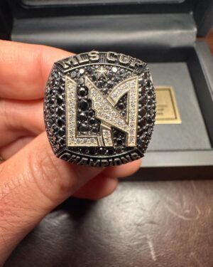 Jaime Camil Instagram - The love I have for @lafc @lafc3252 is unmeasurable 🖤💛 Thank you @lafclarry @lafcrich and all #LAFC owners/managers 🙏🏽🙇🏽‍♂️ I’m extremely humbled by your kindness and generosity ☺️ This championship ring represents 5 years of uninterrupted support, being at all home games, dozens of “away” games, tears, screams, joy, laughter and inexplainable passion. I’ll wear it with pride. You can find rings and championship LAFC jewelry at https://lafcrings.com @baronchampionshiprings
This ring features: 67 white diamonds representing total season points, 128 black diamonds to commemorate Bale’s goal at the 128th minute during the final, the left shoulder shows the team’s jersey pattern and 78 total white diamonds celebrating all goals from the season, right shoulder presents name and year of the championship and supporters’ Shield, inside engraving features the scores of all three playoff victories and “Forza Mo”, paying respects to our beloved Mo Fascio and finally, outside shank engraving holds our rally cry… “FOR LOS ANGELES”.