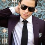 Jake T. Austin Instagram - Captions and comments are cool, but I always look forward to connecting with you more comprehensively. I recently had a conversation with @hauteliving about my current life and goals for the future: check it out at hauteliving.com. And of course, thanks to all of you for continuing to show your love; I wouldn’t be here without you. #summersolstice Shoutout to the creative team: Photographer: @mitchdao.photos Suiting/attire: @indochino Shoes/accessories: @shopnewrepublic @menlohouse Eyewear: @prada Venue: @lapeerhotel Kimpton La Peer Hotel