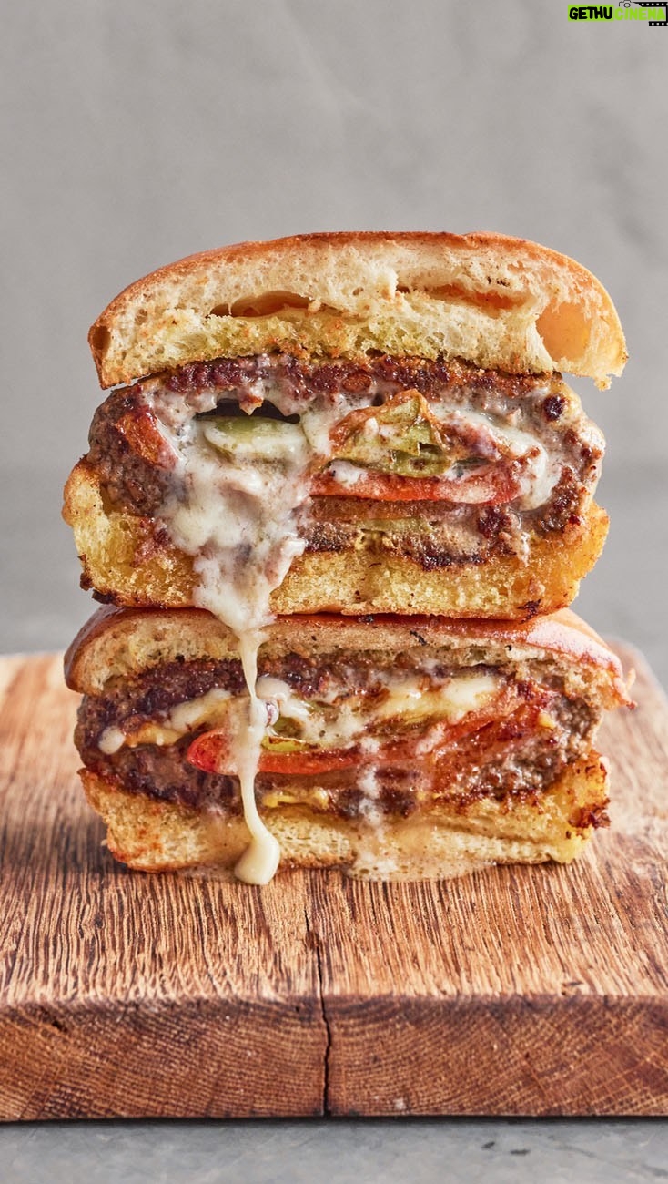 Jamie Oliver Instagram - I’ve got a totally epic way to upgrade your homemade burgers.....I really think this one might be my most exciting one yet !! My loaded beef burger with sweet roasted peppers, pickles and cheese stuffed inside the patty really is another level. And a lovely ingredient hack is adding lentils to the party as it means you can use less meat but still make hearty burgers. Come on !!! Recipe link for this beaut in my bio x x x #burger #weekendvibes #dinnerideas