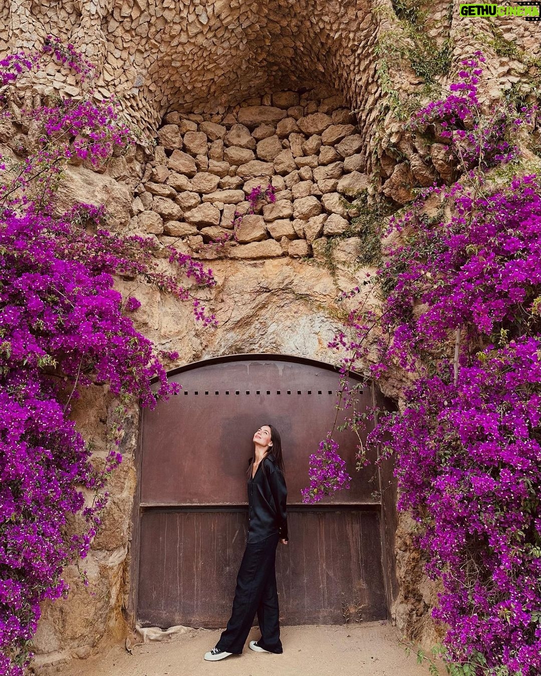 Jasmine Curtis-Smith Instagram - Buenos Dias 🌺 Park Güell blooming throughout spring and summer, abundantly framing a rusting door and weaving amongst the rock columns and structures. 💜 Funny little kwento – while strolling about this area, everyone was focused on getting into the Park’s main scenic view spot/square to take photos on that side for the view of BCN. @tracyayson and I loooooved the framing of these bougainvilleas so we snapped a few shots without us in the frame, next thing you know a line was formed behind her and an old American couple negotiated and insisted an exchange - “Take our photo, and I’ll take yours!” Sabay abot ng phone at puesto sa flowers just as I was about to walk for this shot. No need for a response daw 😄 #JCStrips