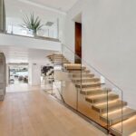 Jason Oppenheim Instagram - Just Sold - 2201 Bayside Dr. - $24,500,000 5 Beds / 9 Baths / 9,129 Sq. Ft. This newly constructed custom estate offers exclusive Corona Del Mar waterfront living with intricate design touches and a harmonious blend of natural stone and wood elements. Consisting of 5 ensuite bedrooms and 9 bathrooms and approximately 50 feet of private beachfront, it caters to water enthusiasts and offers shared ownership of one of the longest private docks on the west coast, capable of accommodating multiple yachts up to 100ft in length. Upon arrival, you will be greeted by meticulously landscaped surroundings, a grand pivot door, and a double height foyer that sets the tone for the residence. Inside, the space boasts European wide plank bleached oak flooring by Gaetano, illuminated floating staircases, and expansive glass features that fill the approximately 9,129 square feet of interiors with an abundance of natural light. The property seamlessly connects to its surroundings through slide-away pocket doors that open onto a heated patio, a zero-edge saltwater pool and spa, and a courtyard featuring a built-in Lynx Grill. The kitchen features custom Honed Calcatta Vagli slab countertops and backsplash, a 55” La Canche designer stove imported from Paris, a butler’s pantry, and stained white oak cabinetry. Convenience is paramount, with a Waupaca elevator servicing all four floors, including the lower level, which encompasses a media area, a dry bar, and temperature controlled wine room. Upstairs, the owner’s suite presents a heated wraparound balcony with mesmerizing water views, a living space with a fireplace, and two spa-like bathrooms, each complemented by its own walk-in closet. The top level reveals a lounge area that opens onto a rooftop deck with grass and sweeping views of the Newport Beach Harbor offering limitless ocean-view entertaining. Equipped with cutting-edge technology, the property also includes a nearly 3,000 sq. ft., 6+ car garage with epoxy flooring. Expertly designed by Brandon Architects, Patterson Custom Homes, Harvard Investment Group, and Brooke Wagner Design. Listed by: @mskaylacardona @briancharlesfurstenfeld Matthew Peters @jasonoppenheim