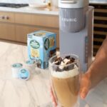 Jason Oppenheim Instagram - #ad Summer Fridays with the three loves of my life. Niko, Zelda and @keurig 😉 Since I got this K-ICED brewer and these ridiculously good @greenmtncoffee ICED Vanilla Caramel K-Cup pods, I can have an iced coffee no matter what I’m doing around the house. I might not leave home at all this summer. Well, maybe to sell a few houses... Grab yours at Keurig.com. #keurigpartner