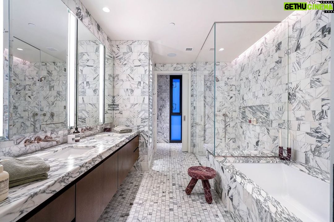 Jason Oppenheim Instagram - Just Listed - The Pendry Residences #307 - $4,195,000 2 Beds / 3 Baths / 2,393 Sq. Ft. Immerse yourself in luxury at the Pendry Residences, a 24-hour full-service amenity building, located on the iconic Sunset Strip in West Hollywood. Residence 307 offers unparalleled privacy with breathtaking south-facing Downtown LA views. Serene and sophisticated, the home exudes an opulent ambiance with wide plank white oak flooring and floor-to-ceiling glass walls that bathe the space in natural light. The chef's kitchen, designed by Martin Brudnizki, is the perfect blend of functionality and elegance equipped with top-of-the-line Subzero and Wolf appliances, custom white oak stained cabinetry, Waterworks fixtures, and an oversized Calacata Borghini marble island. The generously sized primary suite is a haven of luxury, featuring a customized Poliform walk-in closet and a marble spa-like bathroom with custom double vanities and high-end polished chrome fixtures. Completing the residence are a guest bedroom with en-suite bath, powder room, laundry room, in-wall speakers, direct access via a private elevator, and two side-by-side parking spaces equipped with a triple charger. The Pendry Residences offers a range of residential amenities, including 24-hour concierge and security services, valet parking, a state-of-the-art fitness center, a resident lounge, a tranquil garden deck, a rooftop pool, and services of the Pendry Hotel. West Hollywood, California