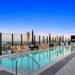 Jason Oppenheim Instagram - Just Listed - The Pendry Residences #307 - $4,195,000 2 Beds / 3 Baths / 2,393 Sq. Ft. Immerse yourself in luxury at the Pendry Residences, a 24-hour full-service amenity building, located on the iconic Sunset Strip in West Hollywood. Residence 307 offers unparalleled privacy with breathtaking south-facing Downtown LA views. Serene and sophisticated, the home exudes an opulent ambiance with wide plank white oak flooring and floor-to-ceiling glass walls that bathe the space in natural light. The chef's kitchen, designed by Martin Brudnizki, is the perfect blend of functionality and elegance equipped with top-of-the-line Subzero and Wolf appliances, custom white oak stained cabinetry, Waterworks fixtures, and an oversized Calacata Borghini marble island. The generously sized primary suite is a haven of luxury, featuring a customized Poliform walk-in closet and a marble spa-like bathroom with custom double vanities and high-end polished chrome fixtures. Completing the residence are a guest bedroom with en-suite bath, powder room, laundry room, in-wall speakers, direct access via a private elevator, and two side-by-side parking spaces equipped with a triple charger. The Pendry Residences offers a range of residential amenities, including 24-hour concierge and security services, valet parking, a state-of-the-art fitness center, a resident lounge, a tranquil garden deck, a rooftop pool, and services of the Pendry Hotel. West Hollywood, California