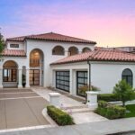 Jason Oppenheim Instagram - Just Listed - 22 Ritz Cove - $15,900,000 5 Beds / 5 Baths / 5,502 Sq. Ft. / 9,660 Lot Size Welcome to this exquisite oceanfront residence situated in the guard-gated community of Ritz Cove, one of the most sought-after coastal communities in Orange County where unrivaled luxury and exclusivity converge. Nestled between the iconic Ritz Carlton luxury hotel and the Monarch Beach Golf Course, this one-of-a-kind beachfront property offers breathtaking year-round views of sunsets over the break at Salt Creek Beach and Catalina Island from nearly every room in the home. Upon entering, you are enveloped by the welcoming, bright and airy floor plan and feel instantly at peace in your own private oasis. Five bedrooms and five bathrooms are spread across two levels, and a bonus room provides the flexibility to create a home office, media room, or gym. The large curved glass window in the kitchen invites the ocean inside, while the attached living room space creates an entertaining paradise that opens up onto the private patio with spa, setting the perfect stage for outdoor gatherings and sophisticated entertaining. The master suite is a true sanctuary, featuring an expansive bedroom and private balcony with sweeping views of the Pacific Ocean and the Ritz Carlton. The master bath boasts a lavish soaking tub for two, a separate shower, and exquisite dual vanities, all under a skylight that bathes the room in a glowing light. The suite extends into an extensive private master closet space apportioned with all the necessary amenities, including a 3-way mirror and attached locking closet. Additionally, a private stairway with a private gated entrance grants direct access to the pristine beach and countless walking trails directly from the backyard. This breathtaking beachfront property presents an unparalleled opportunity for a personal haven of relaxation and entertaining while offering the most captivating ocean and white-water views. Co-listed with @katinreinhardt Dana Point