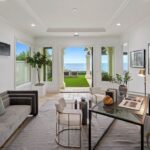Jason Oppenheim Instagram - Just Listed - 22 Ritz Cove - $15,900,000 5 Beds / 5 Baths / 5,502 Sq. Ft. / 9,660 Lot Size Welcome to this exquisite oceanfront residence situated in the guard-gated community of Ritz Cove, one of the most sought-after coastal communities in Orange County where unrivaled luxury and exclusivity converge. Nestled between the iconic Ritz Carlton luxury hotel and the Monarch Beach Golf Course, this one-of-a-kind beachfront property offers breathtaking year-round views of sunsets over the break at Salt Creek Beach and Catalina Island from nearly every room in the home. Upon entering, you are enveloped by the welcoming, bright and airy floor plan and feel instantly at peace in your own private oasis. Five bedrooms and five bathrooms are spread across two levels, and a bonus room provides the flexibility to create a home office, media room, or gym. The large curved glass window in the kitchen invites the ocean inside, while the attached living room space creates an entertaining paradise that opens up onto the private patio with spa, setting the perfect stage for outdoor gatherings and sophisticated entertaining. The master suite is a true sanctuary, featuring an expansive bedroom and private balcony with sweeping views of the Pacific Ocean and the Ritz Carlton. The master bath boasts a lavish soaking tub for two, a separate shower, and exquisite dual vanities, all under a skylight that bathes the room in a glowing light. The suite extends into an extensive private master closet space apportioned with all the necessary amenities, including a 3-way mirror and attached locking closet. Additionally, a private stairway with a private gated entrance grants direct access to the pristine beach and countless walking trails directly from the backyard. This breathtaking beachfront property presents an unparalleled opportunity for a personal haven of relaxation and entertaining while offering the most captivating ocean and white-water views. Co-listed with @katinreinhardt Dana Point