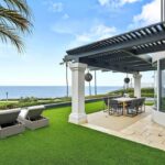 Jason Oppenheim Instagram - Just Listed - 22 Ritz Cove - $15,900,000 5 Beds / 5 Baths / 5,502 Sq. Ft. / 9,660 Lot Size Welcome to this exquisite oceanfront residence situated in the guard-gated community of Ritz Cove, one of the most sought-after coastal communities in Orange County where unrivaled luxury and exclusivity converge. Nestled between the iconic Ritz Carlton luxury hotel and the Monarch Beach Golf Course, this one-of-a-kind beachfront property offers breathtaking year-round views of sunsets over the break at Salt Creek Beach and Catalina Island from nearly every room in the home. Upon entering, you are enveloped by the welcoming, bright and airy floor plan and feel instantly at peace in your own private oasis. Five bedrooms and five bathrooms are spread across two levels, and a bonus room provides the flexibility to create a home office, media room, or gym. The large curved glass window in the kitchen invites the ocean inside, while the attached living room space creates an entertaining paradise that opens up onto the private patio with spa, setting the perfect stage for outdoor gatherings and sophisticated entertaining. The master suite is a true sanctuary, featuring an expansive bedroom and private balcony with sweeping views of the Pacific Ocean and the Ritz Carlton. The master bath boasts a lavish soaking tub for two, a separate shower, and exquisite dual vanities, all under a skylight that bathes the room in a glowing light. The suite extends into an extensive private master closet space apportioned with all the necessary amenities, including a 3-way mirror and attached locking closet. Additionally, a private stairway with a private gated entrance grants direct access to the pristine beach and countless walking trails directly from the backyard. This breathtaking beachfront property presents an unparalleled opportunity for a personal haven of relaxation and entertaining while offering the most captivating ocean and white-water views. Co-listed with @katinreinhardt Dana Point