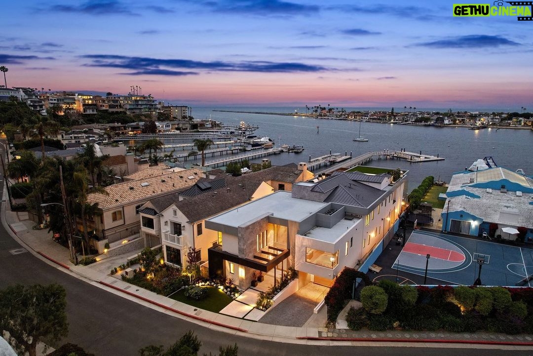 Jason Oppenheim - 53.2K Likes - Just Listed - 2201 Bayside Dr. - $27,995,000
5 Beds / 9 Baths / 9,129 Sq. Ft. / 11,921 Lot Size
This newly constructed custom estate offers exclusive Corona Del Mar waterfront living with intricate design touches and a harmonious blend of natural stone and wood elements. Consisting of 5 ensuite bedrooms and 9 bathrooms and boasting approximately 50 feet of private beachfront, it caters to water enthusiasts and offers shared ownership of one of the longest private docks on the west coast, capable of accommodating multiple yachts up to 100ft in length. Upon arrival, you will be greeted by meticulously landscaped surroundings, a striking grand pivot door, and a double height foyer that sets the tone for the residence. Inside, the space boasts European wide plank bleached oak flooring by Gaetano, illuminated floating staircases, and expansive glass features that fill the approximately 9,129 square feet of interiors with an abundance of natural light. The property seamlessly connects to its surroundings through slide-away pocket doors that open onto a heated patio, a zero-edge saltwater pool and spa, and a courtyard featuring a built-in Lynx Grill. The kitchen features custom Honed Calcatta Vagli slab countertops and backsplash, a 55" La Canche designer stove imported from Paris, a butler's pantry, and stained white oak cabinetry. Convenience is paramount, with a Waupaca elevator servicing all four floors, including the lower level, which encompasses a media area, a dry bar, and temperature controlled wine room. Upstairs, the owner's suite presents a heated wraparound balcony with mesmerizing water views, a living space with a fireplace, and two spa-like bathrooms, each complemented by its own walk-in closet. The top level reveals a lounge area that opens onto a rooftop deck with grass and sweeping views of the Newport Beach Harbor offering limitless ocean-view entertaining. Equipped with cutting-edge technology, the property also includes a nearly 3,000 sq. ft., 6+ car garage with epoxy flooring.
Listed by
@briancharlesfurstenfeld
@mskaylacardona
@jasonoppenheim